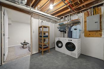 A laundry room with a washer and dryer.